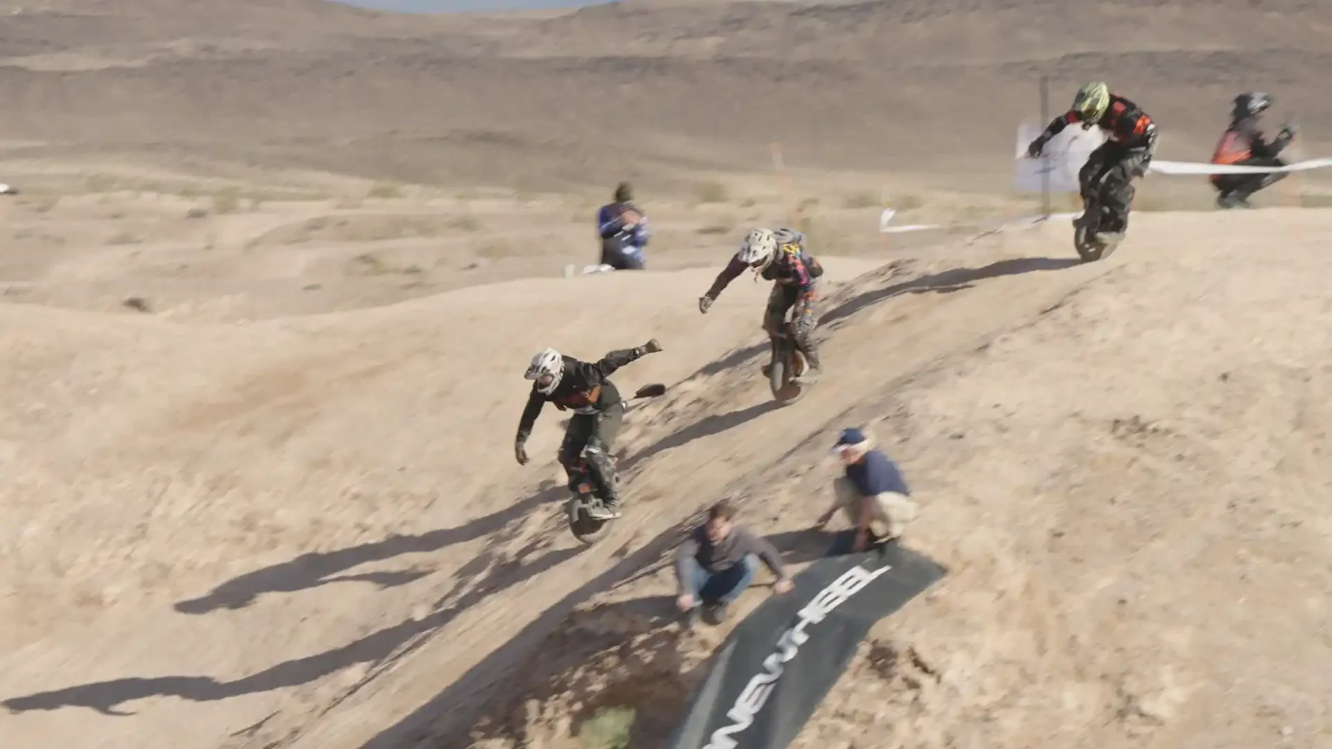 Riders dropping in on The Monstah, the defining feature of the course