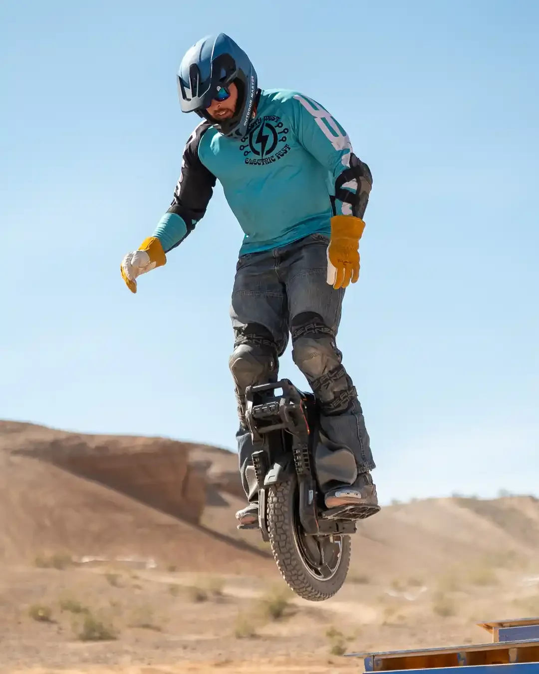 Josh Fagerness jumping over the Triple Z ramp and stair feature.